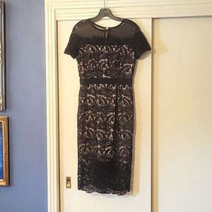 An exquisite black lace cocktail dress Designed by jax's from neiman marcus.